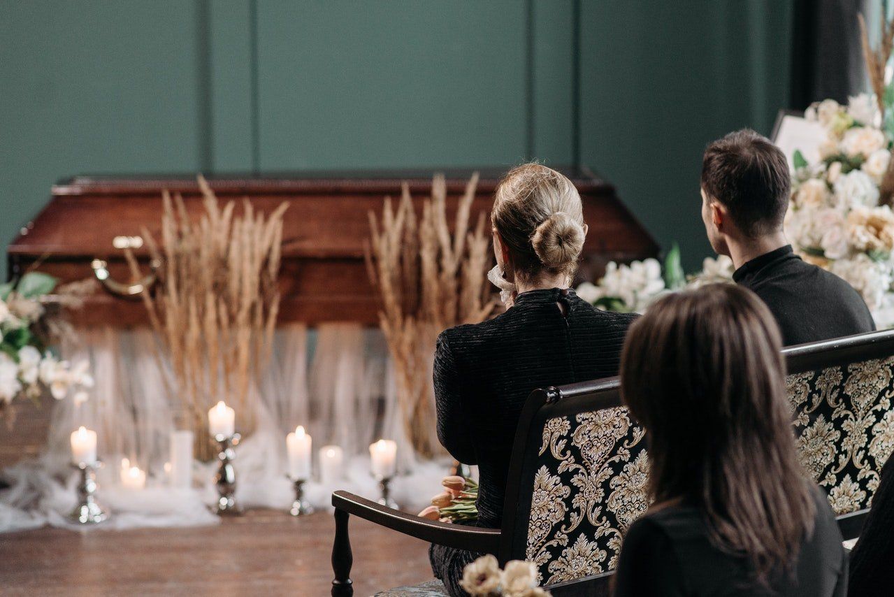 Mand and woman attending a funeral