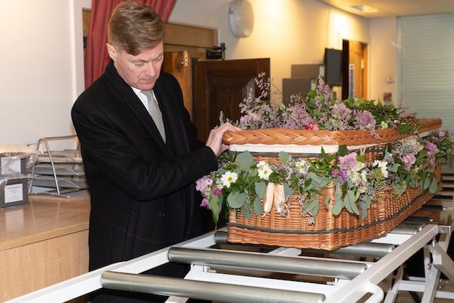 man in a suit at a funeral home