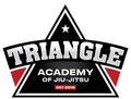 A logo for the triangle academy of jiu-jitsu.