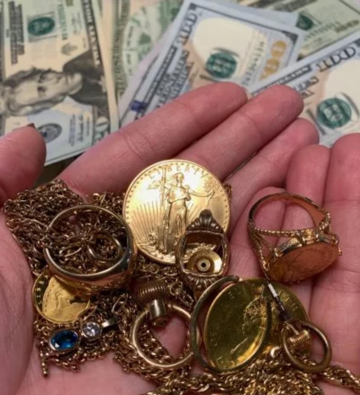 Hands holding assorted gold-colored rings, coins, and jewelry over scattered U.S. dollar bills