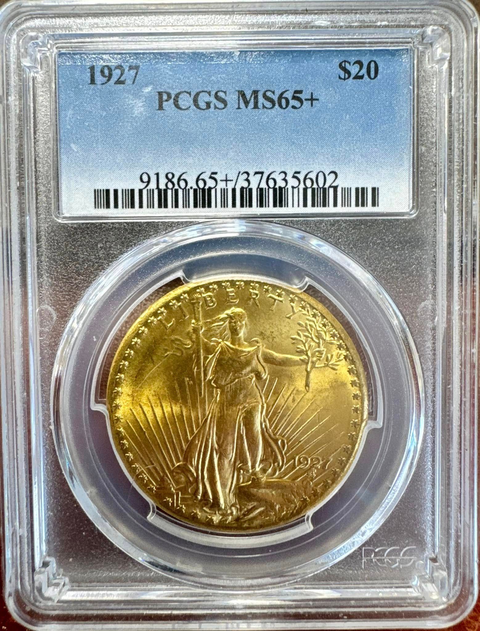 Slabbed 1927 $20 gold coin, PCGS MS65+, shown in a clear protective case.
