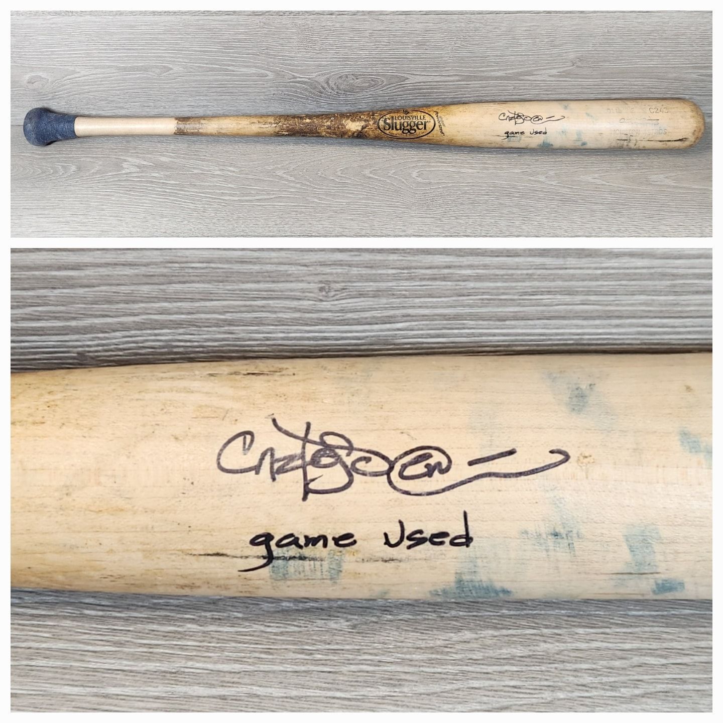 Worn baseball bat with handwritten signature and “game used” on the barrel