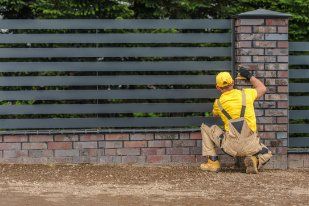 Expert fence contractor working on a residential fencing project in Wollongong NSW.