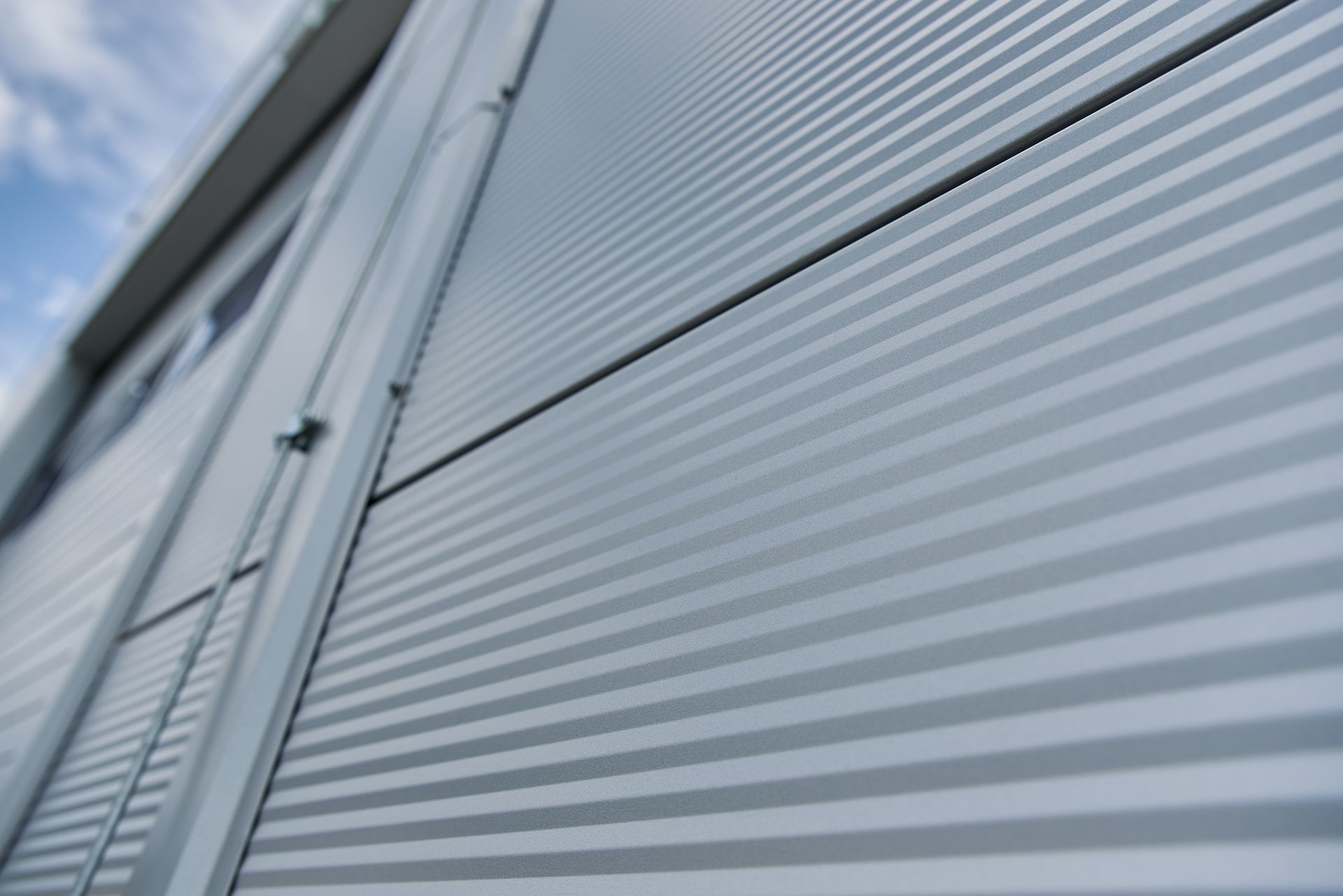 A close up of a metal wall of a building.