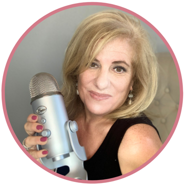 Photo of Lora Shipman holding a silver mic