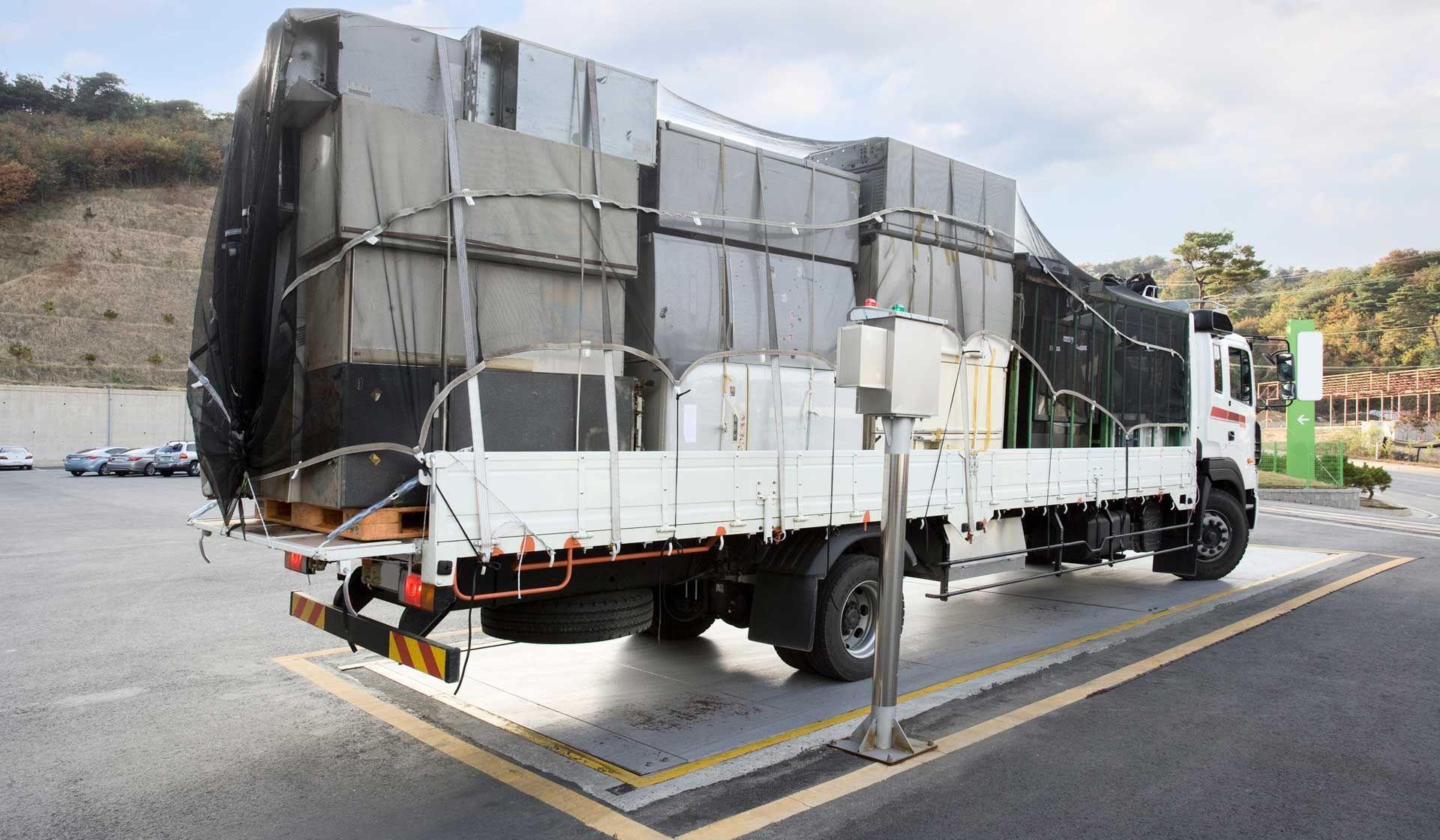 A large white truck is parked in a parking lot.