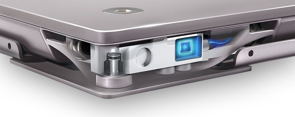 A close up of a laptop with a blue light on it. A close up of a laptop with a blue light on it.