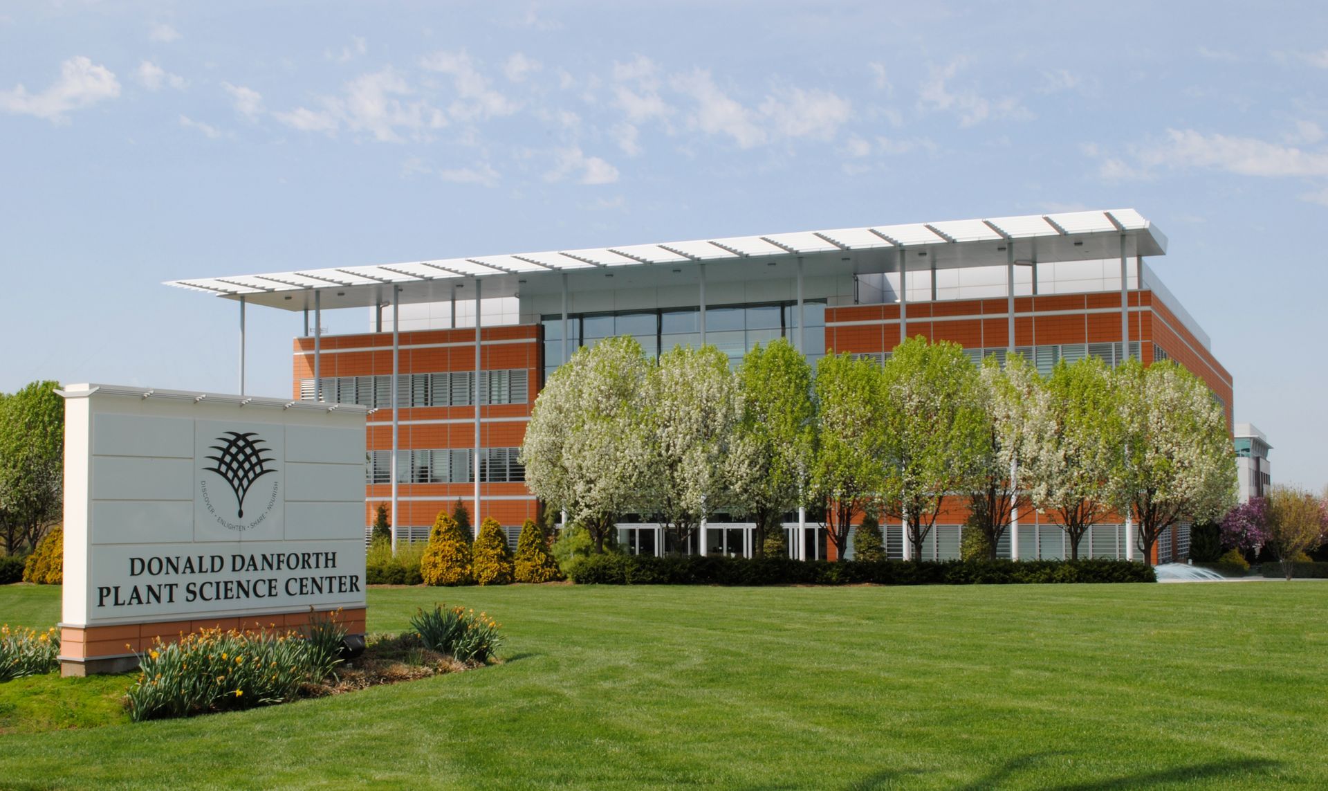 Donald Danforth Plant Science Center building with sign on a sunny day.