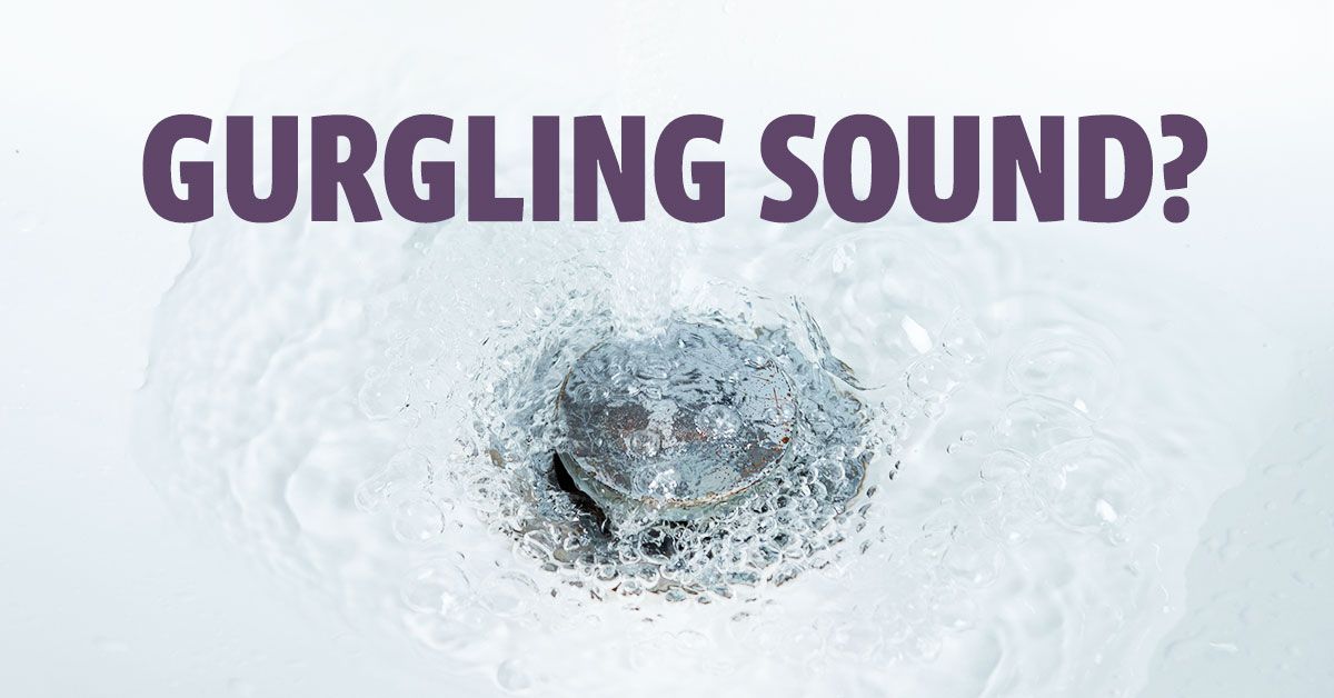 Close-up of a bathroom sink drain with bubbling water, illustrating a gurgling drain caused by a pot