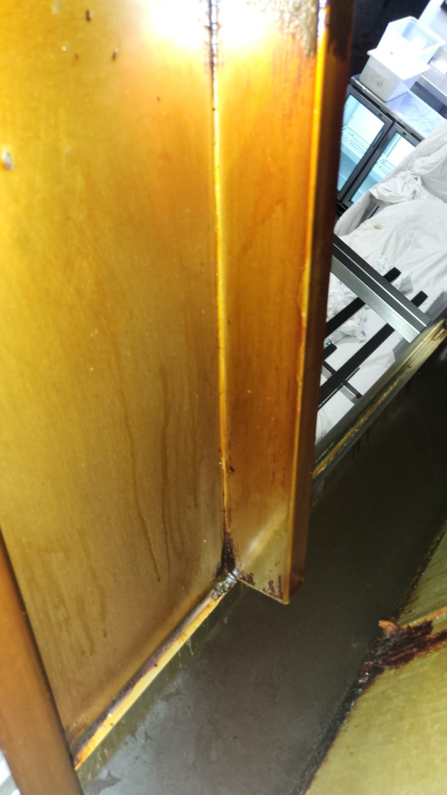 A close up of a wooden door in a room.