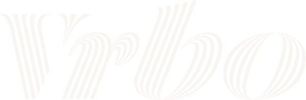 Vrbo logo in white with a stylized, striped font.