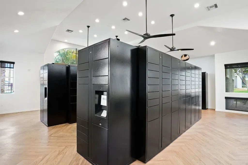 Smart package lockers in a modern community room at Heritage at Deer Valley in Phoenix, AZ.