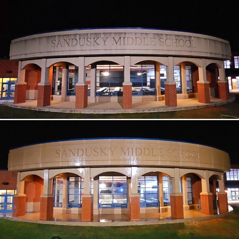 Sandusky Middle School entrance at night, shown in two similar photos.