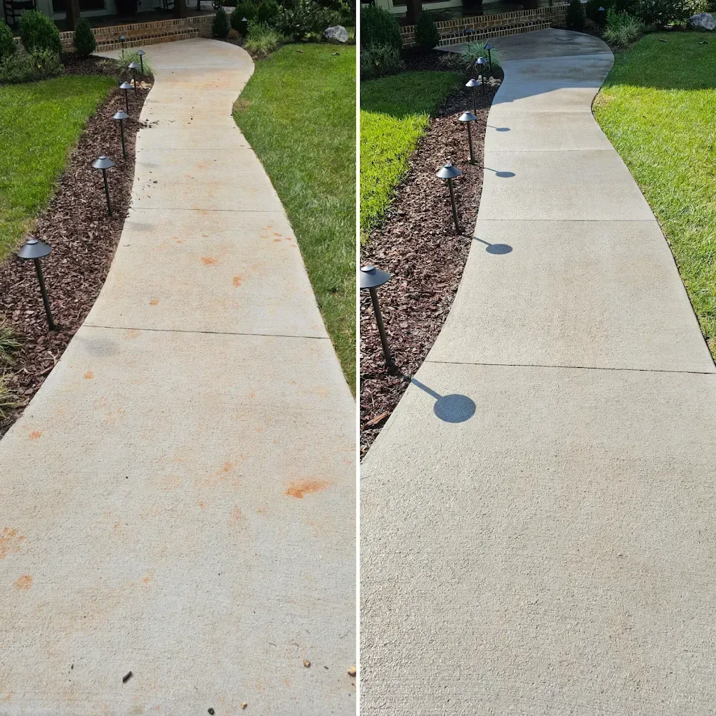 Side-by-side view of a curved concrete walkway before and after cleaning, with garden lights and mulch border