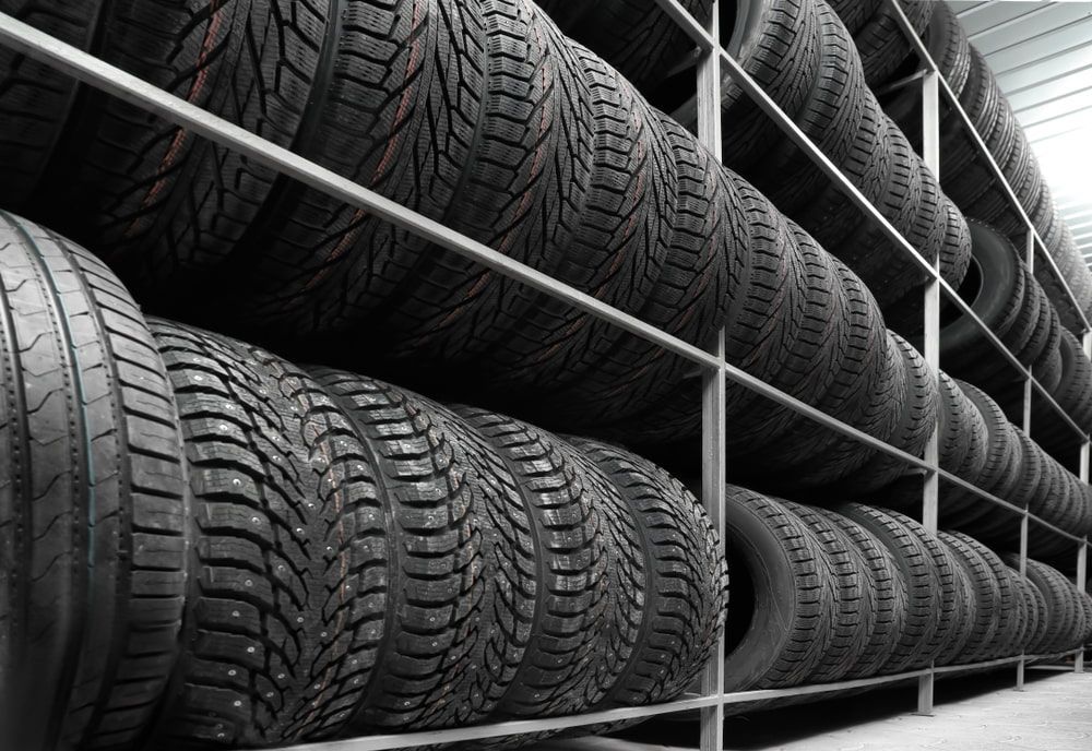 A Warehouse Filled with Lots of Tires on Shelves — Docs Mobile Tyre Service in River Heads, QLD