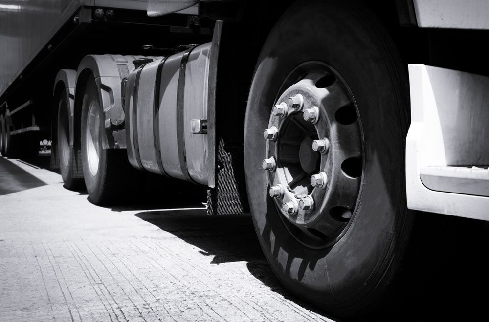 A Black and White Photo of A Semi Truck 's Tires — Docs Mobile Tyre Service in Hervey Bay, QLD