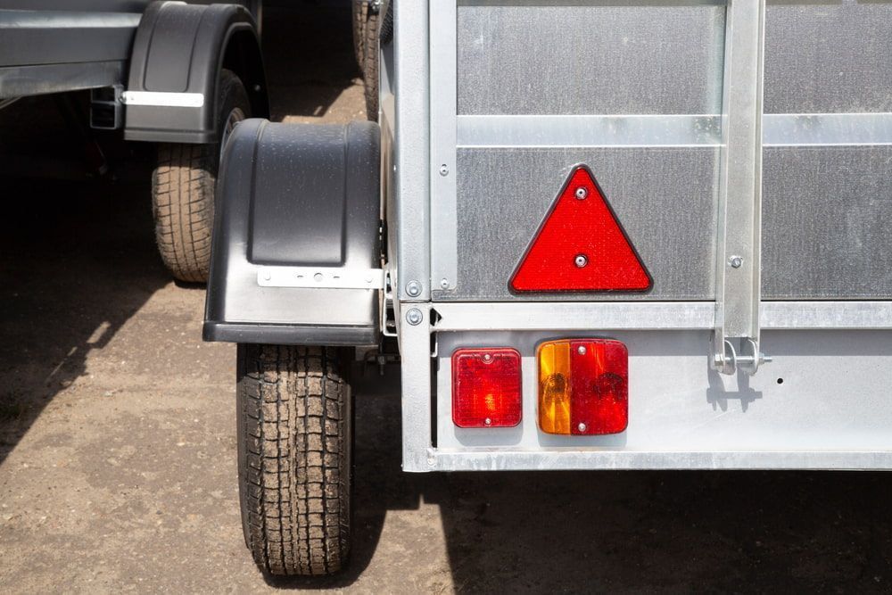 A Trailer With A Red Triangle — Docs Mobile Tyre Service in Hervey Bay, QLD