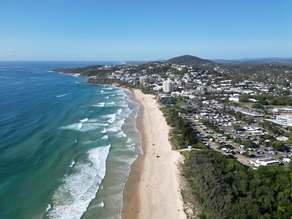Aerial View of a Coastal Neighborhood Beside a Calm Blue Shoreline — Docs Mobile Tyre Service In Maryborough, QLD