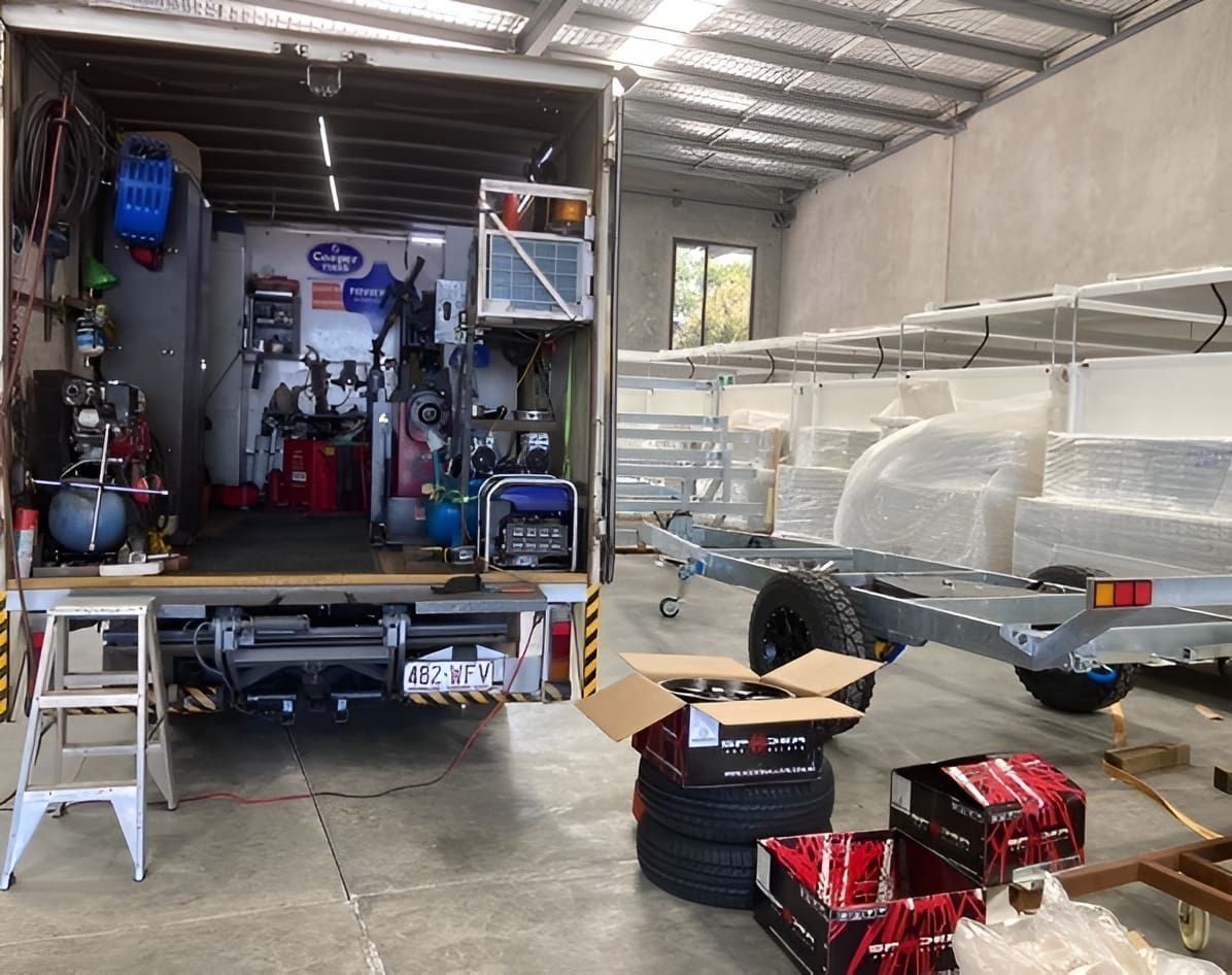 A Trailer is Being Built in a Garage Next to a Truck — Docs Mobile Tyre Service In Yandina, QLD