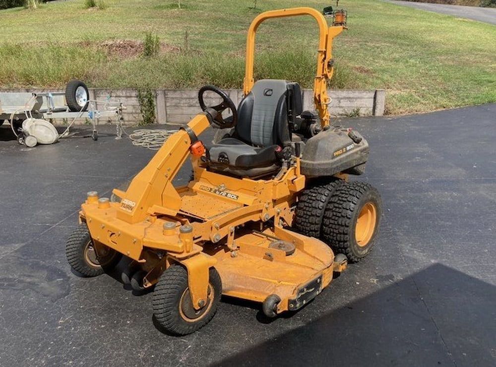 A Yellow Lawn Mower Is Parked On The Side Of The Road — Docs Mobile Tyre Service in Hervey Bay, QLD