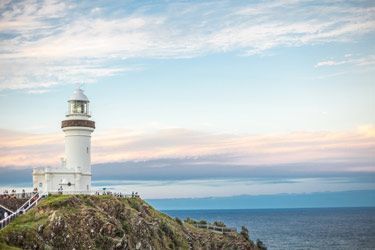 A Lighthouse Is Sitting On Top Of A Cliff — Ballina Demolitions In Byron Bay, NSW