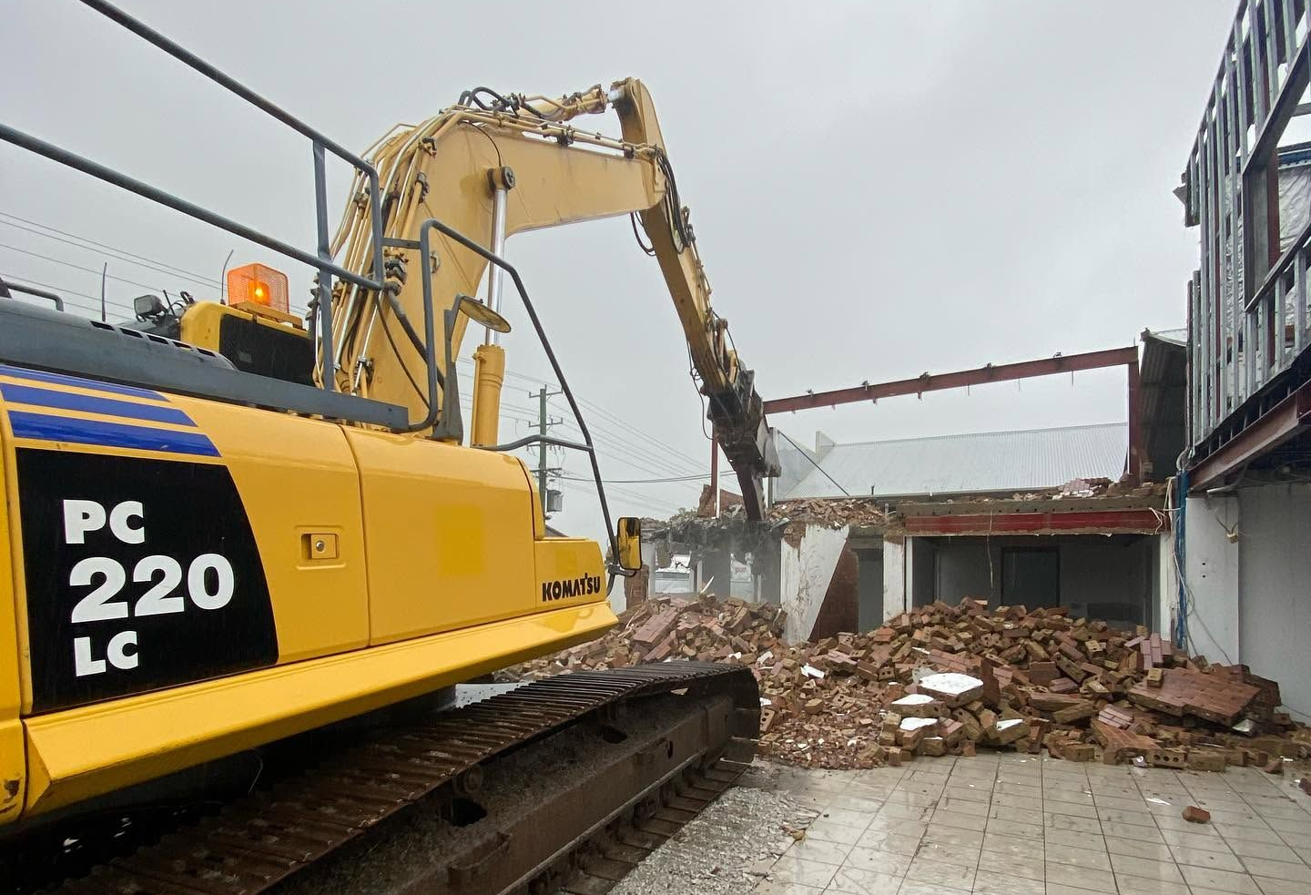 Excavator Performing Demolition In Lismore