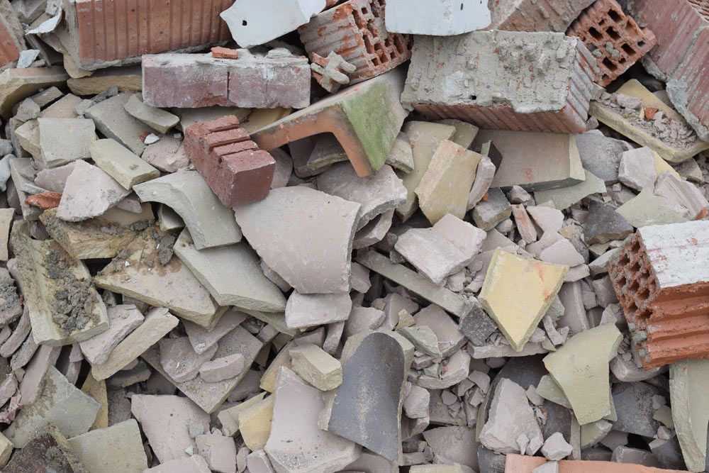 A Pile Of Broken Bricks And Tiles Is Sitting On The Ground — Ballina Demolitions In Tweed Heads, NSW