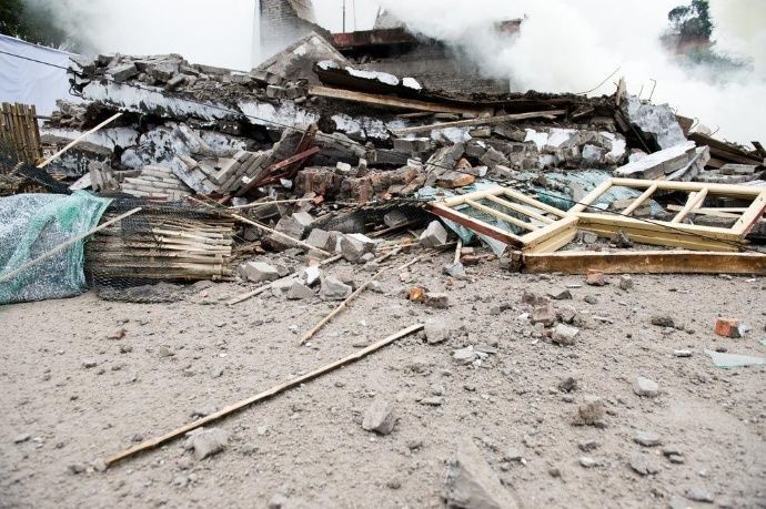 A pile of rubbish, which is the aftermath of a house demolition.