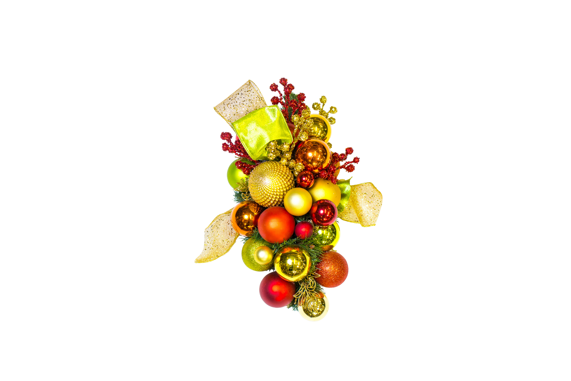 Christmas ornament arrangement with various colored baubles, berries, and ribbon on white background.