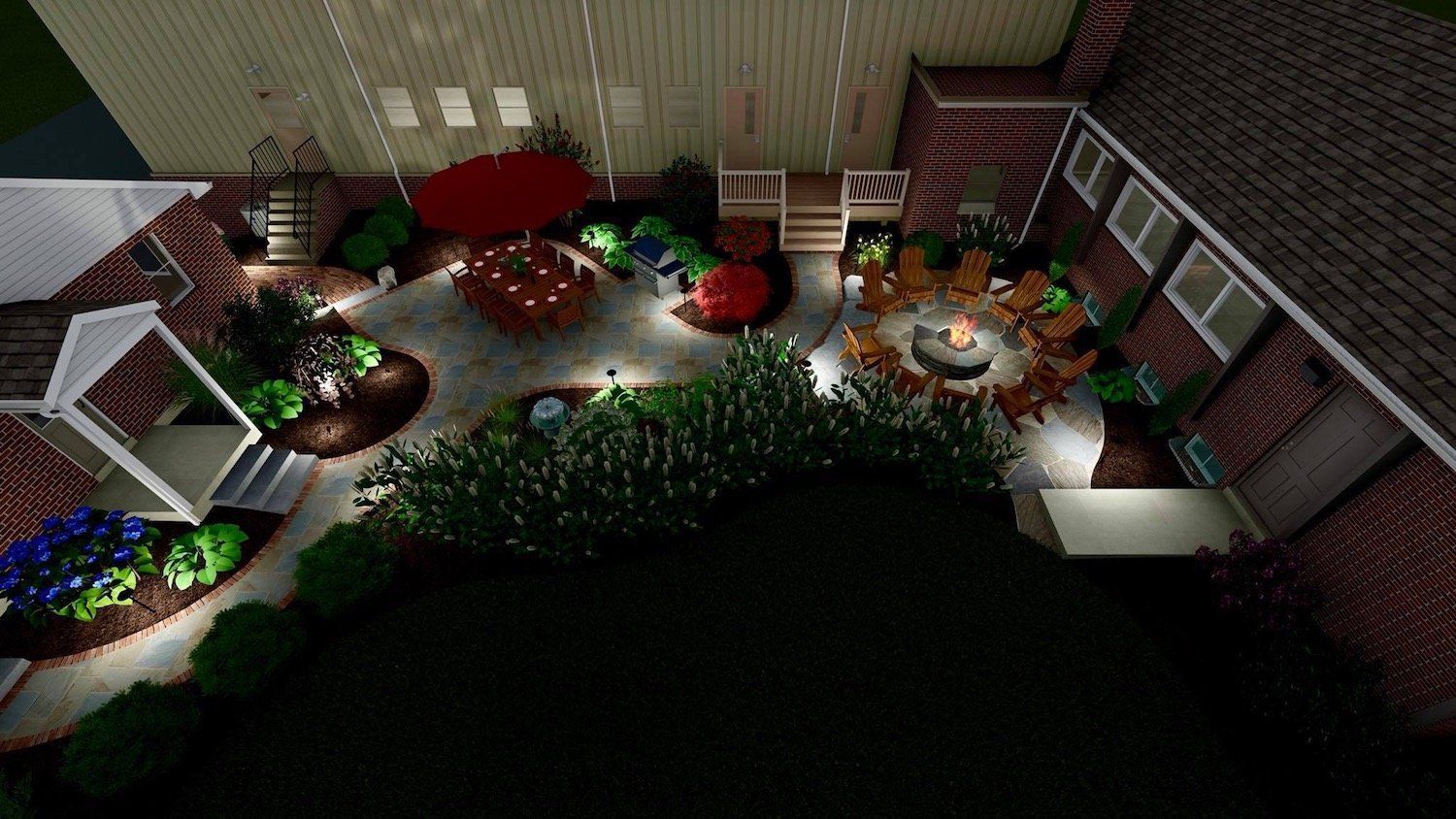 An aerial view of a backyard with a fire pit and patio furniture.