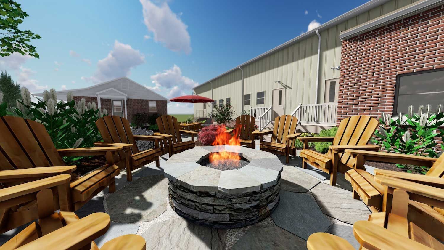 There is a fire pit in the middle of the patio surrounded by wooden chairs.