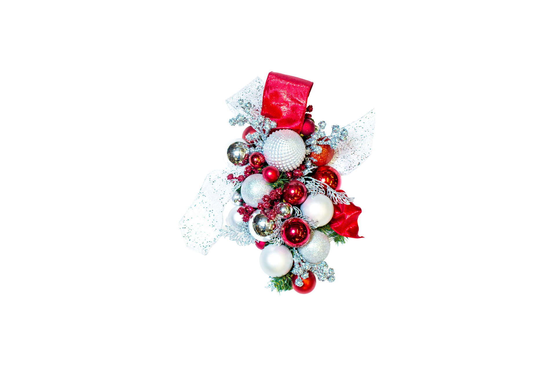 Christmas ornament cluster of red and silver baubles, with a small red gift box.