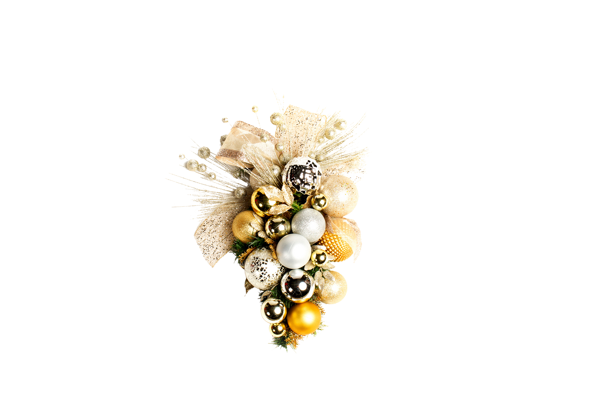 Cluster of gold, silver, and bronze Christmas ornaments with a gold bow on a white background.