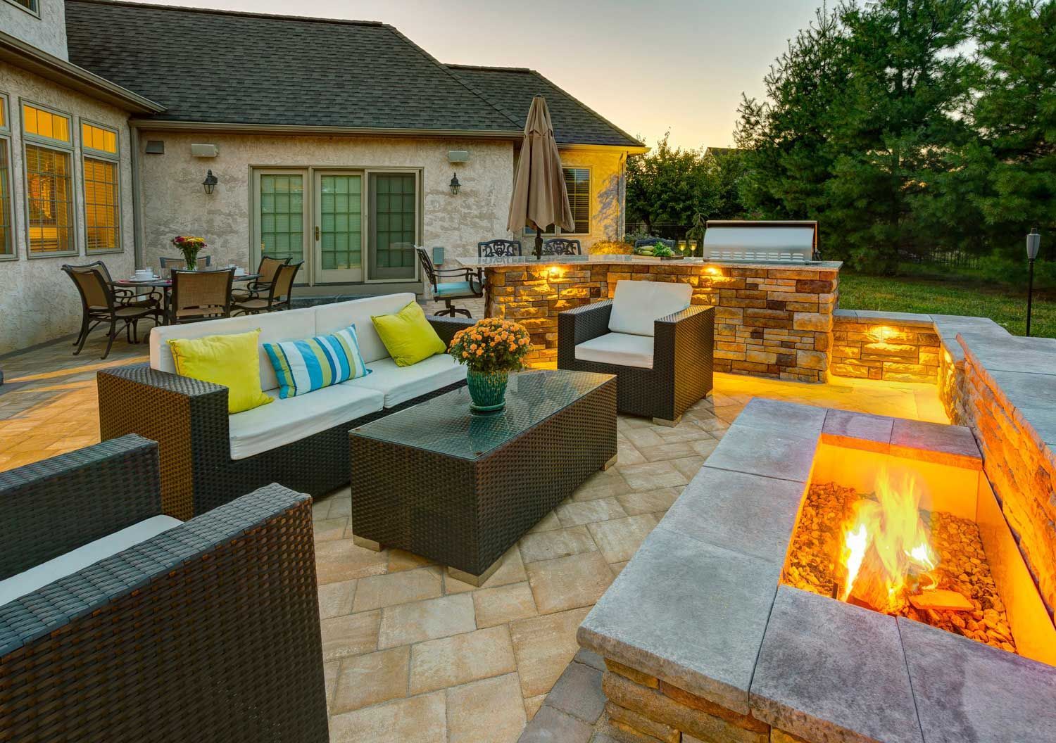 There is a fire pit in the middle of the patio.