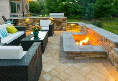 There is a fire pit in the middle of the patio.