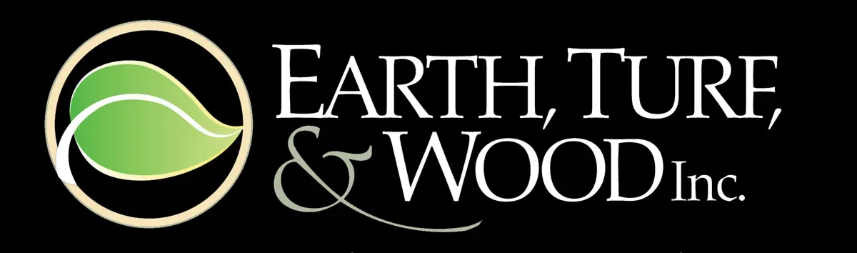 The logo for earth , turf , and wood inc. has a green leaf in a circle.