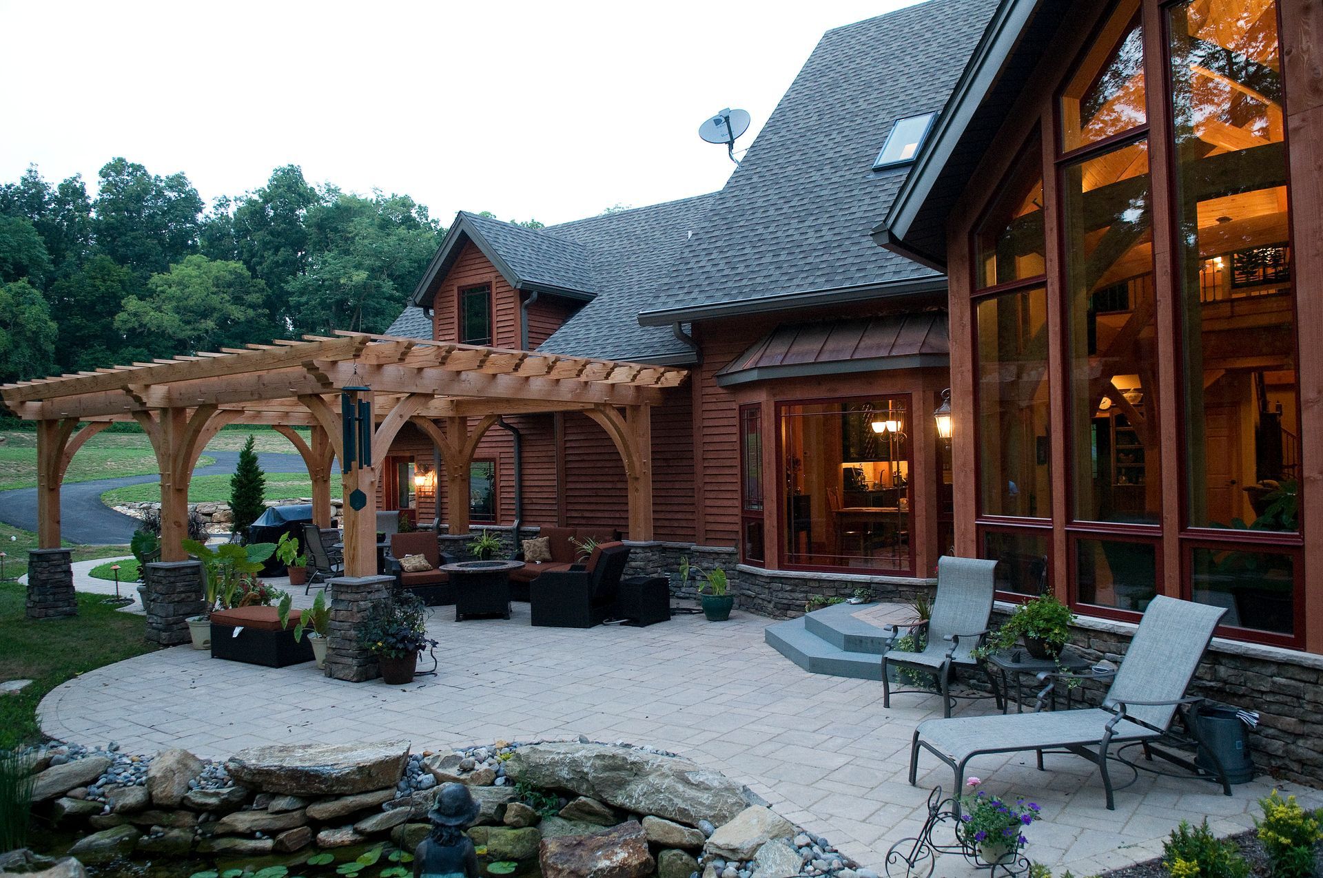 A large house with a lot of windows and a pergola