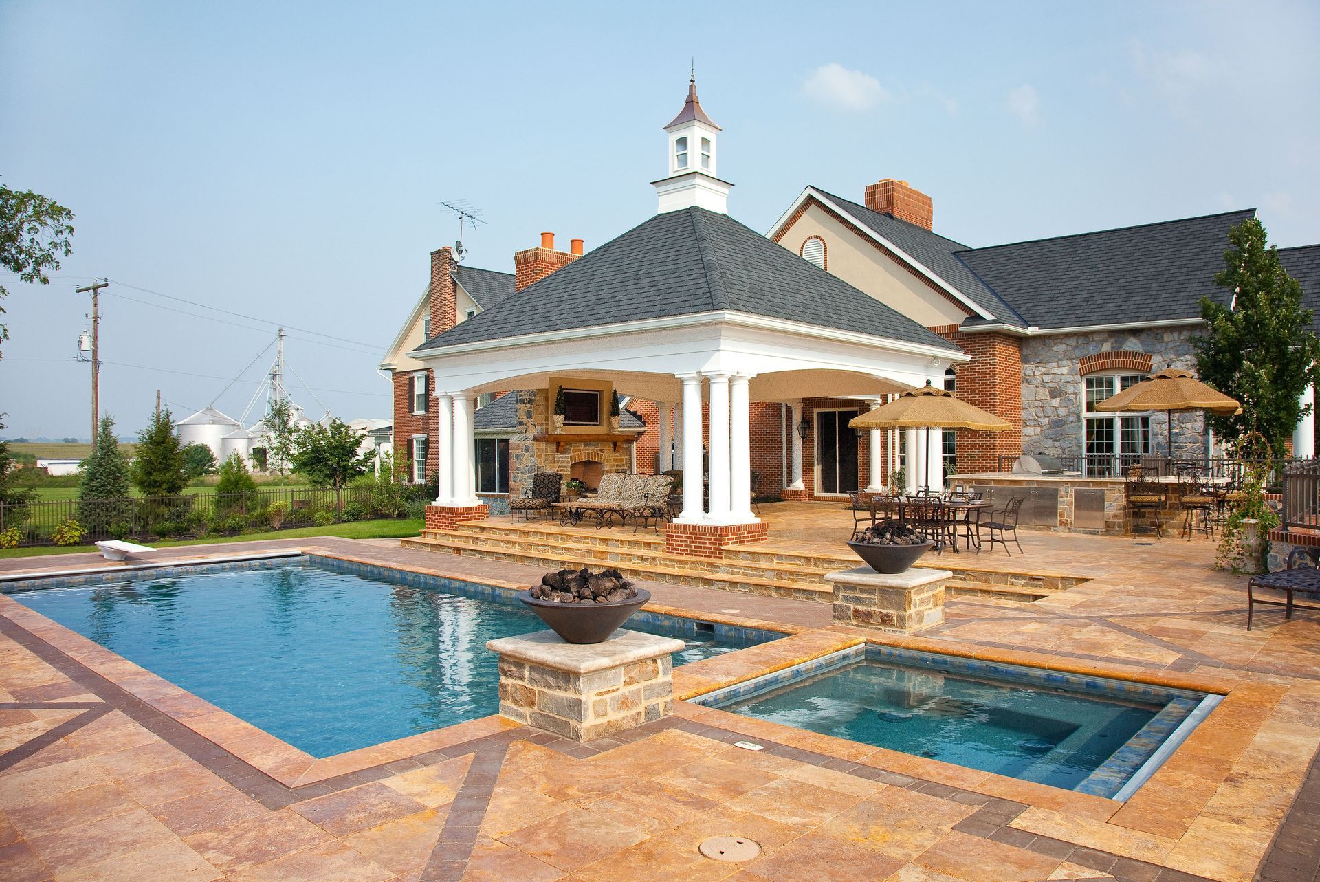 A large house with a swimming pool and a gazebo
