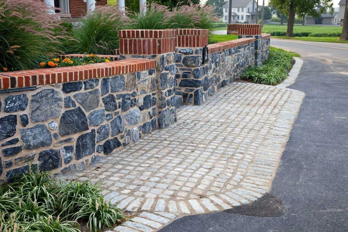 A stone wall along the side of a road