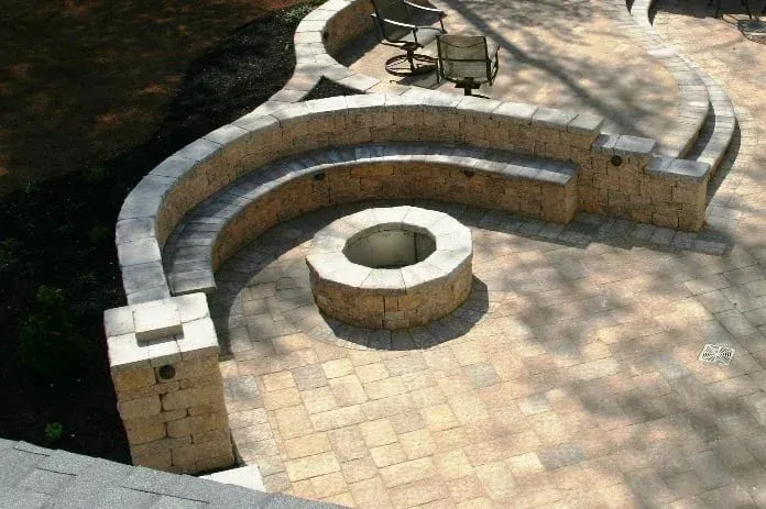 There is a fire pit in the middle of the patio.