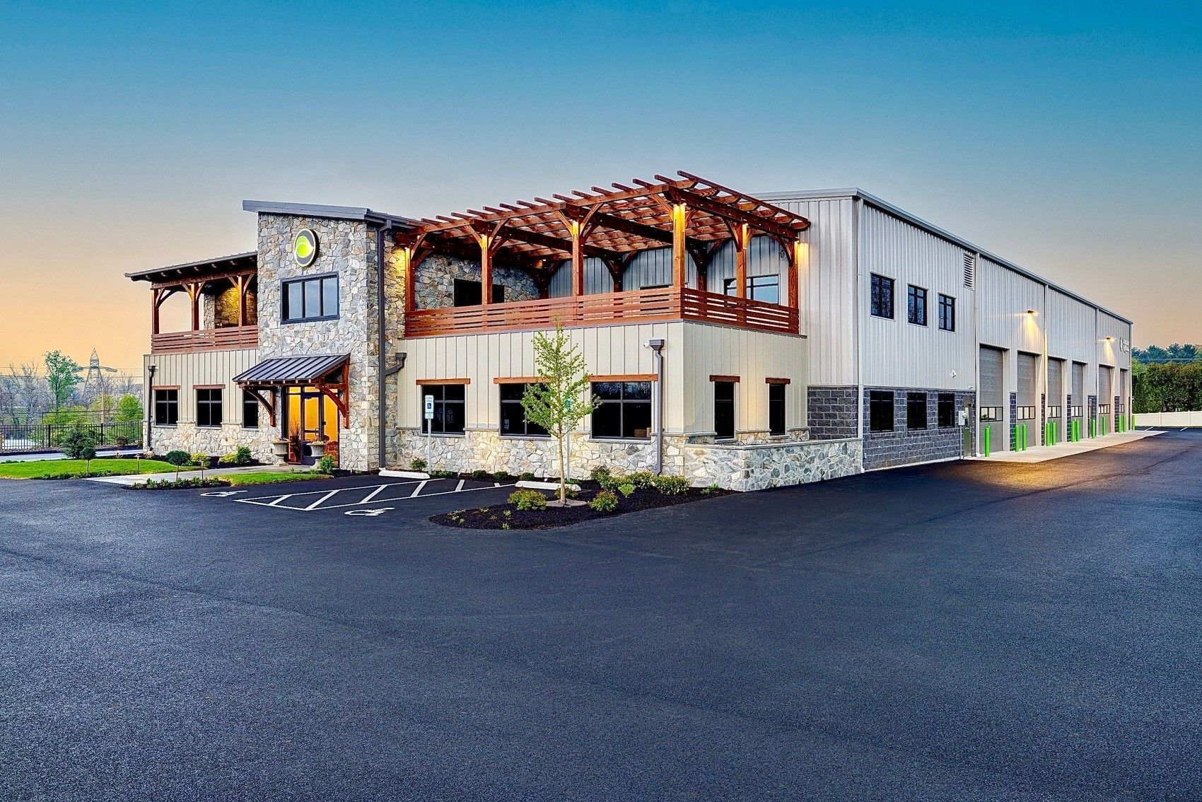 A group of people are sitting around a table eating food. A group of people are sitting around a table eating food.