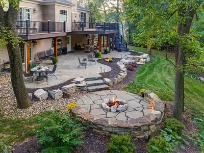 There is a fire pit in the middle of the patio.