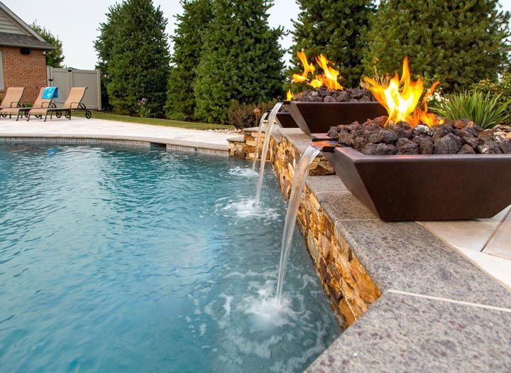 There is a fire pit in the middle of the pool.