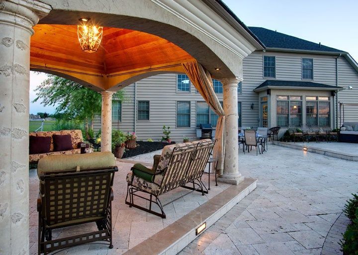 A large house with a gazebo in front of it
