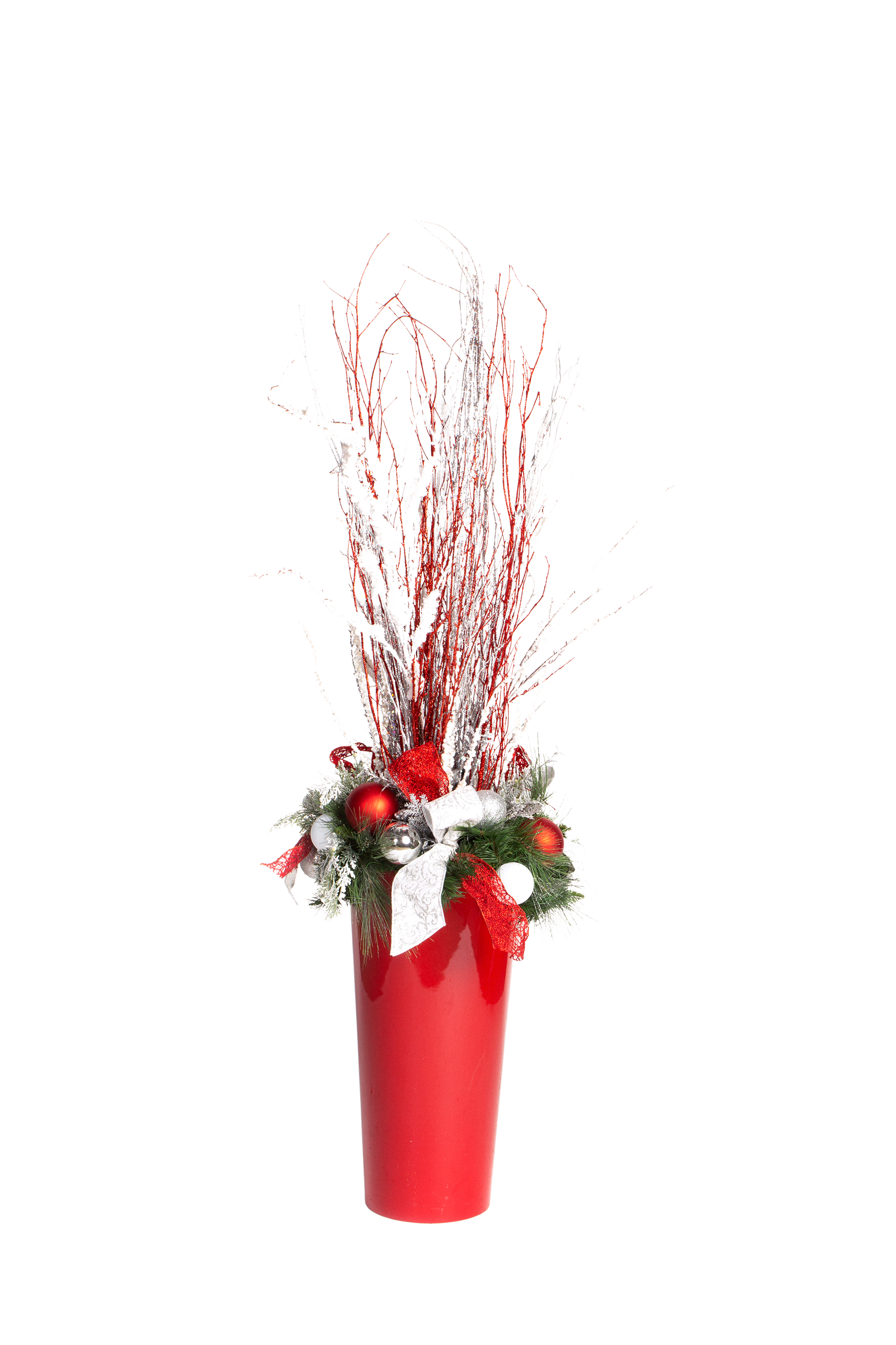 Red vase with Christmas decorations: red branches, ornaments, bow, and garland.