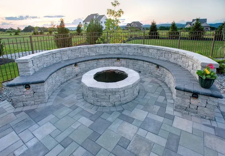 There is a fire pit in the middle of the patio.