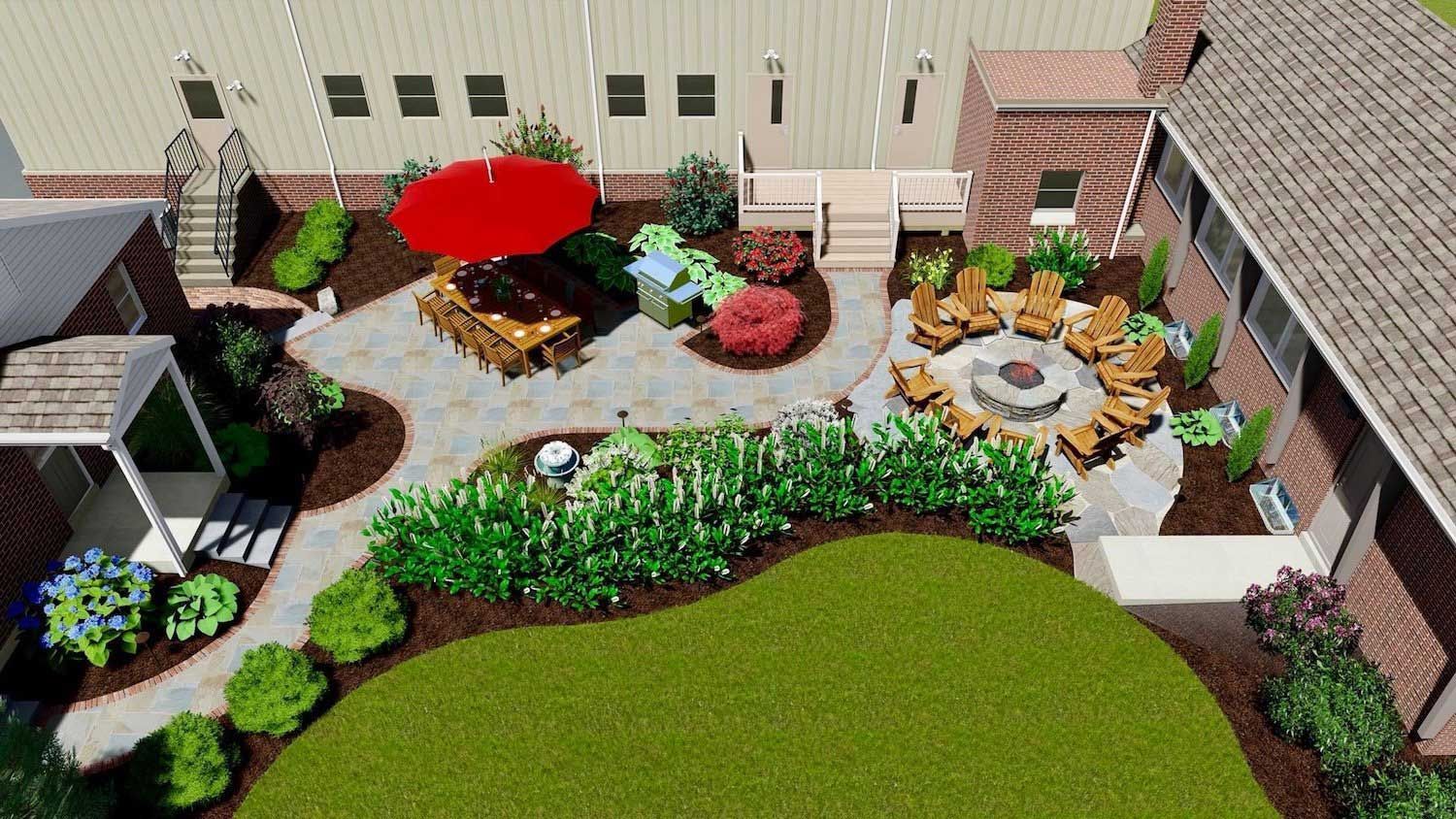 An aerial view of a backyard with a fire pit and patio furniture.