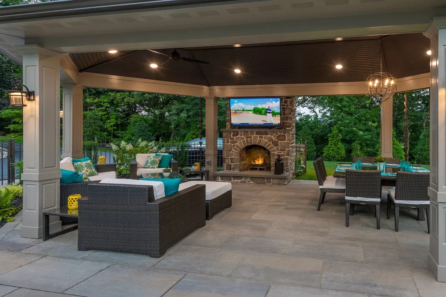 There is a fireplace in the middle of the patio area.