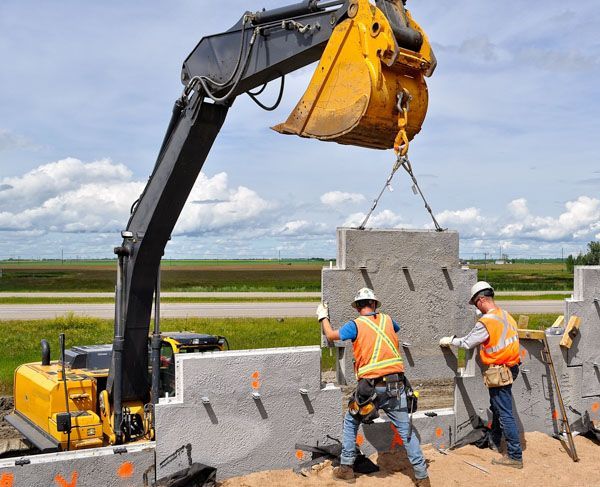 a construction worker is being lifted by a crane