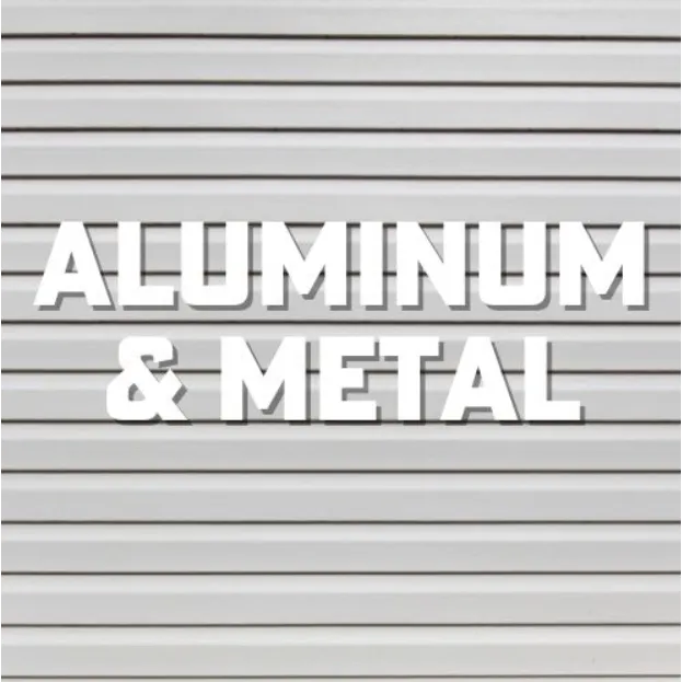 White sign reading “ALUMINUM & METAL” on a light gray corrugated metal background
